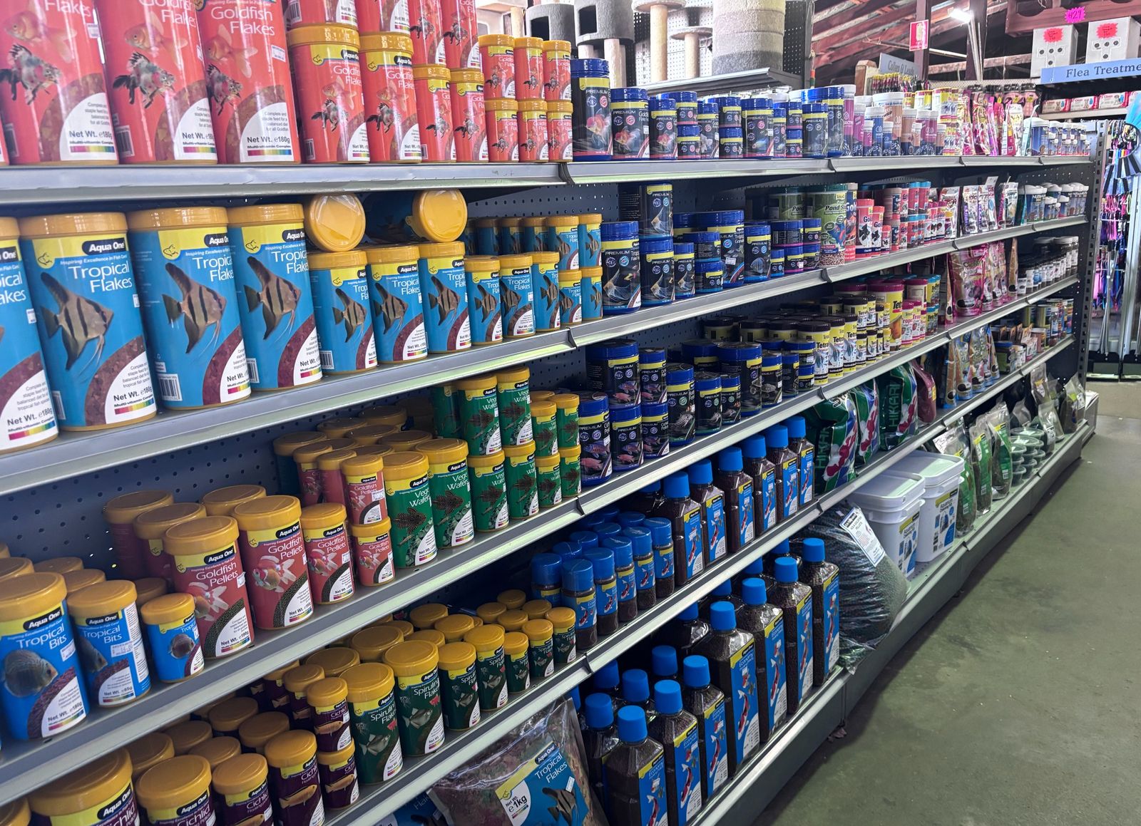 Fish food and aquarium supplies on the shelves